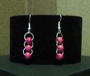 Pendientes hilo plateado con bolitas miyuki rosa