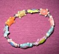 Pulsera elástica de tortugas de ceramicas.