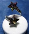 Anillo de plata ajustable con cristales Swarovki en forma de estrella.